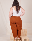 Back view of Heavyweight Trousers in Burnt Terracotta and Cropped Cami in vintage tee off-white worn by Ashley