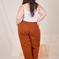 Back view of Heavyweight Trousers in Burnt Terracotta and vintage off-white Cropped Cami worn by Ashley