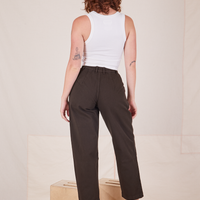 Back view of Heavyweight Trousers in Espresso Brown and vintage off-white Cropped Tank Top worn by Alex