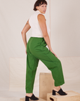Angled back view of Heavyweight Trousers in Lawn Green and Sleeveless Turtleneck in vintage tee off-white worn by Tiara