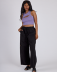 Kandia is wearing the Faded Grape Porthole Tank with Black Drop Pocket Cargo Pants