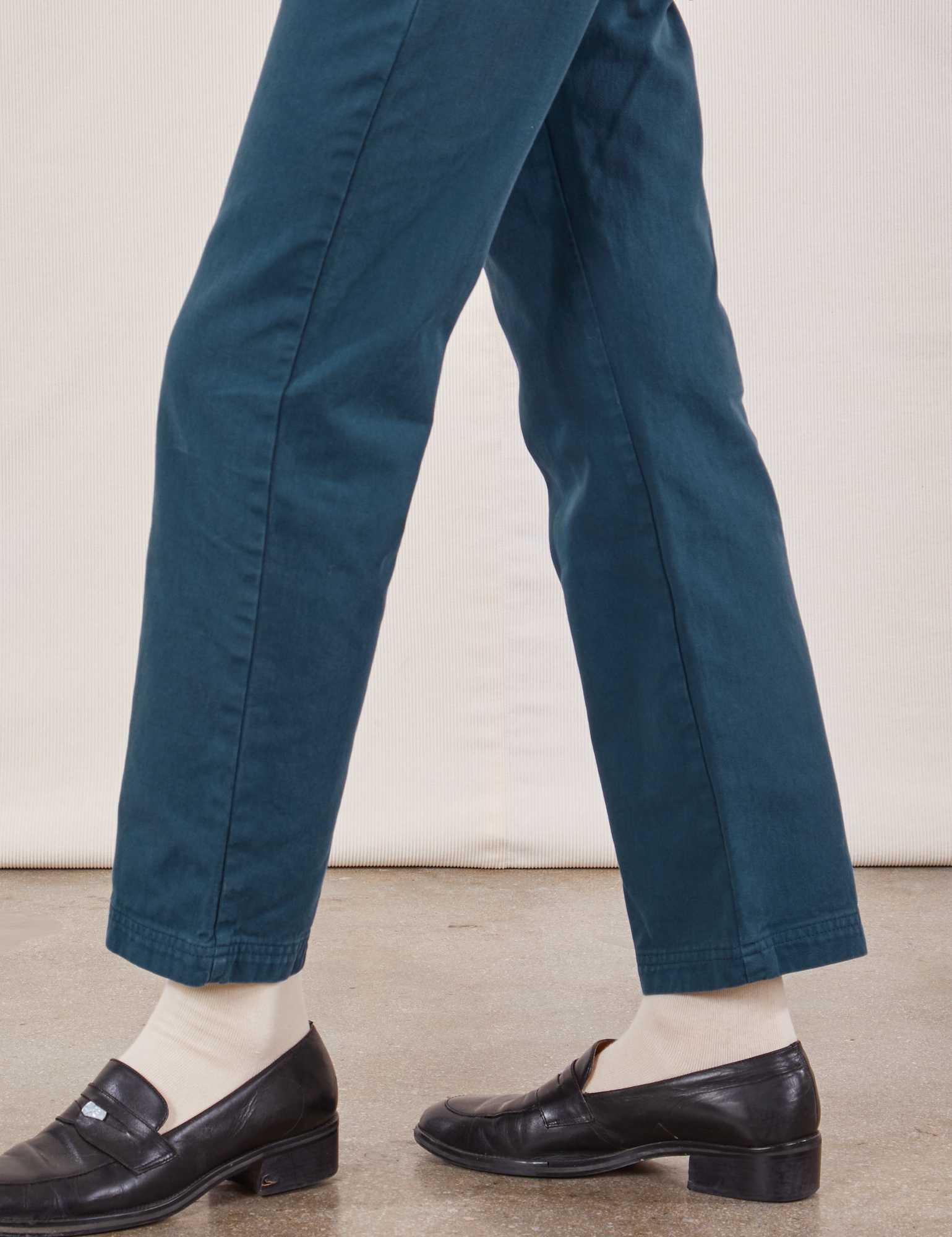 Short Sleeve Jumpsuit in Lagoon pant side leg close up on Alex