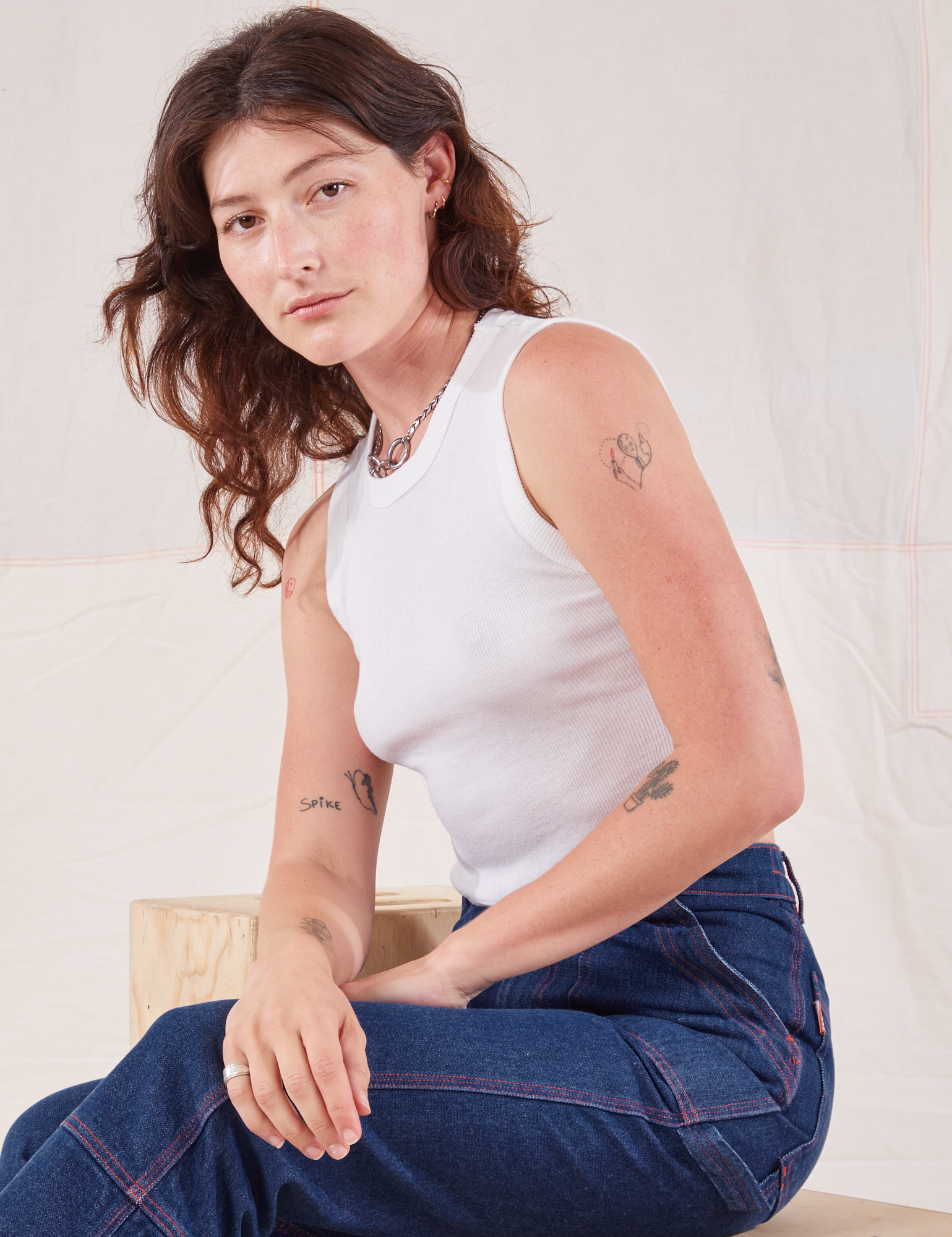 Alex is wearing Muscle Tee in Vintage Tee Off-White