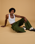 Baggy Mid-Rise Trousers in Evergreen and vintage tee white Cropped Tank on Jerrod