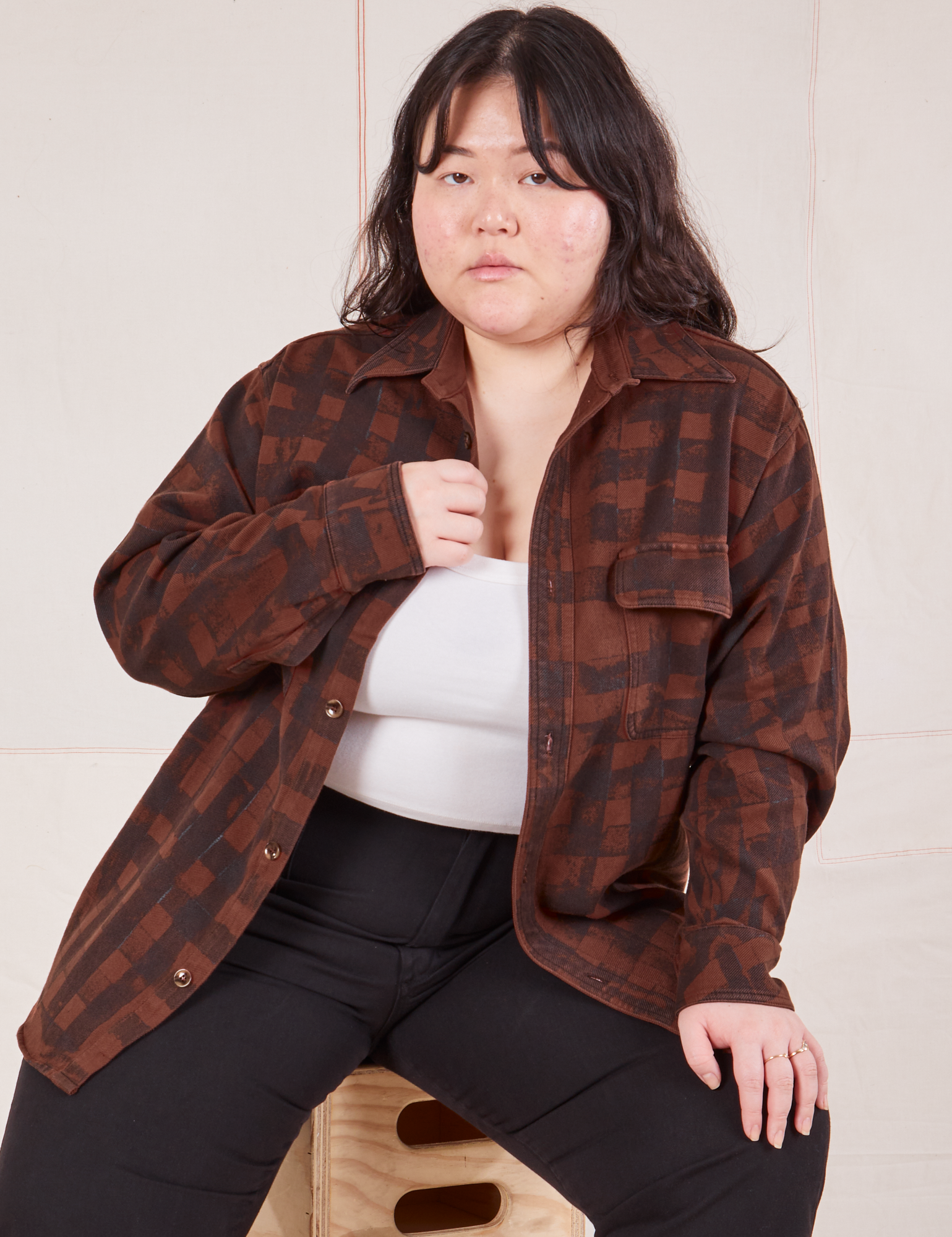 Ashley is wearing Plaid Flannel Overshirt in Fudgesicle Brown