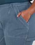 Close up of Morgan's hand in the front pocket of Railroad Carpenter Jeans in Baby Blue