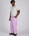 Side view of Drop Pocket Cargo Pants in Lilac Purple and Organic Vintage Tee in Vintage Tee White on Isaac