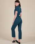 Angled back view of Short Sleeve Jumpsuit in Lagoon on Alex