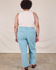 Back view of Work Pants in Baby Blue and Tank Top in vintage tee off-white