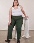 Marielena is wearing Work Pants in Swamp Green and Cropped Tank Top in vintage tee off-white