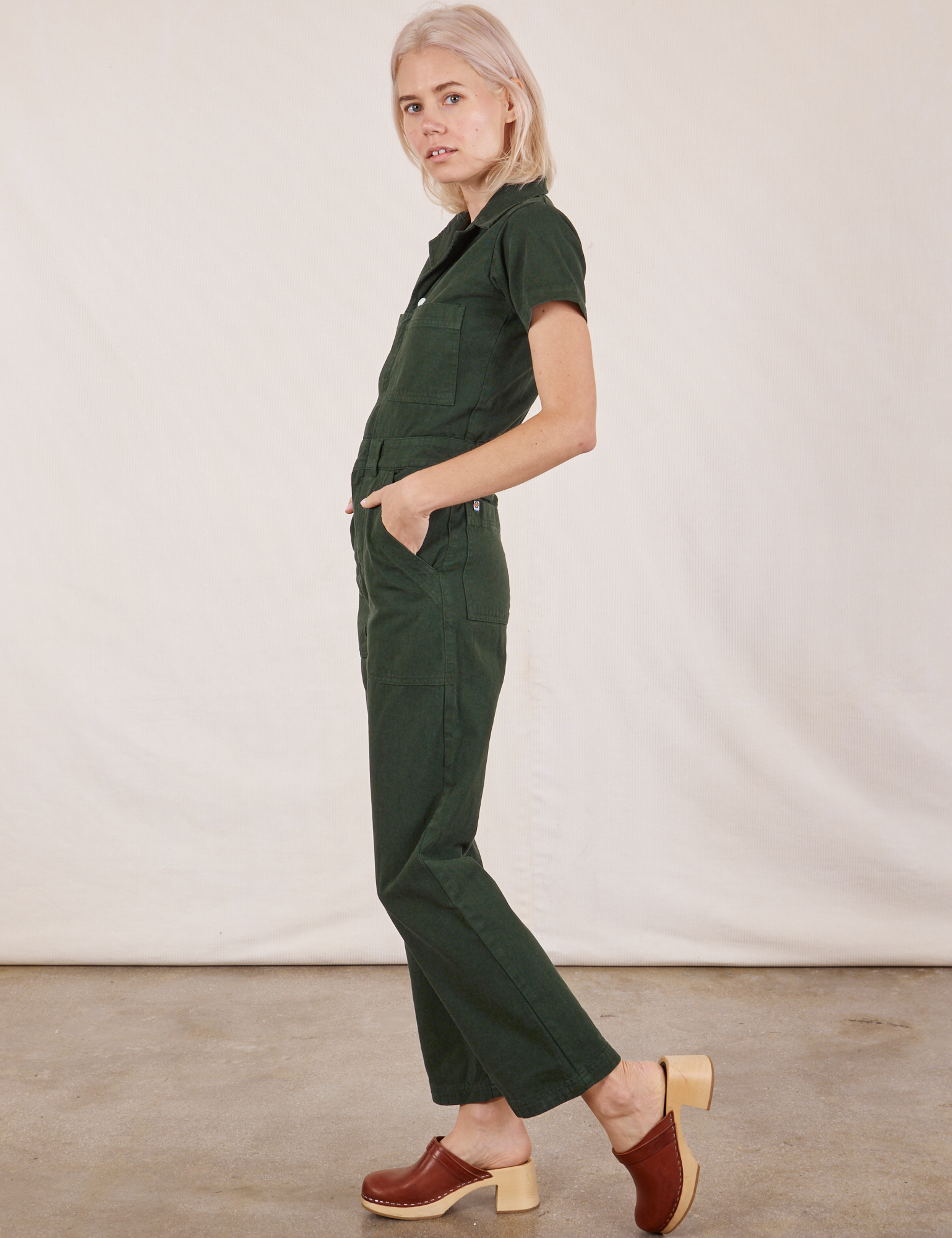 Short Sleeve Jumpsuit in Swamp Green side view on Madeline