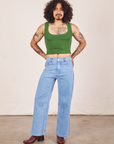 Jesse is wearing Cropped Tank Top in Lawn Green and light wash Sailor Jeans
