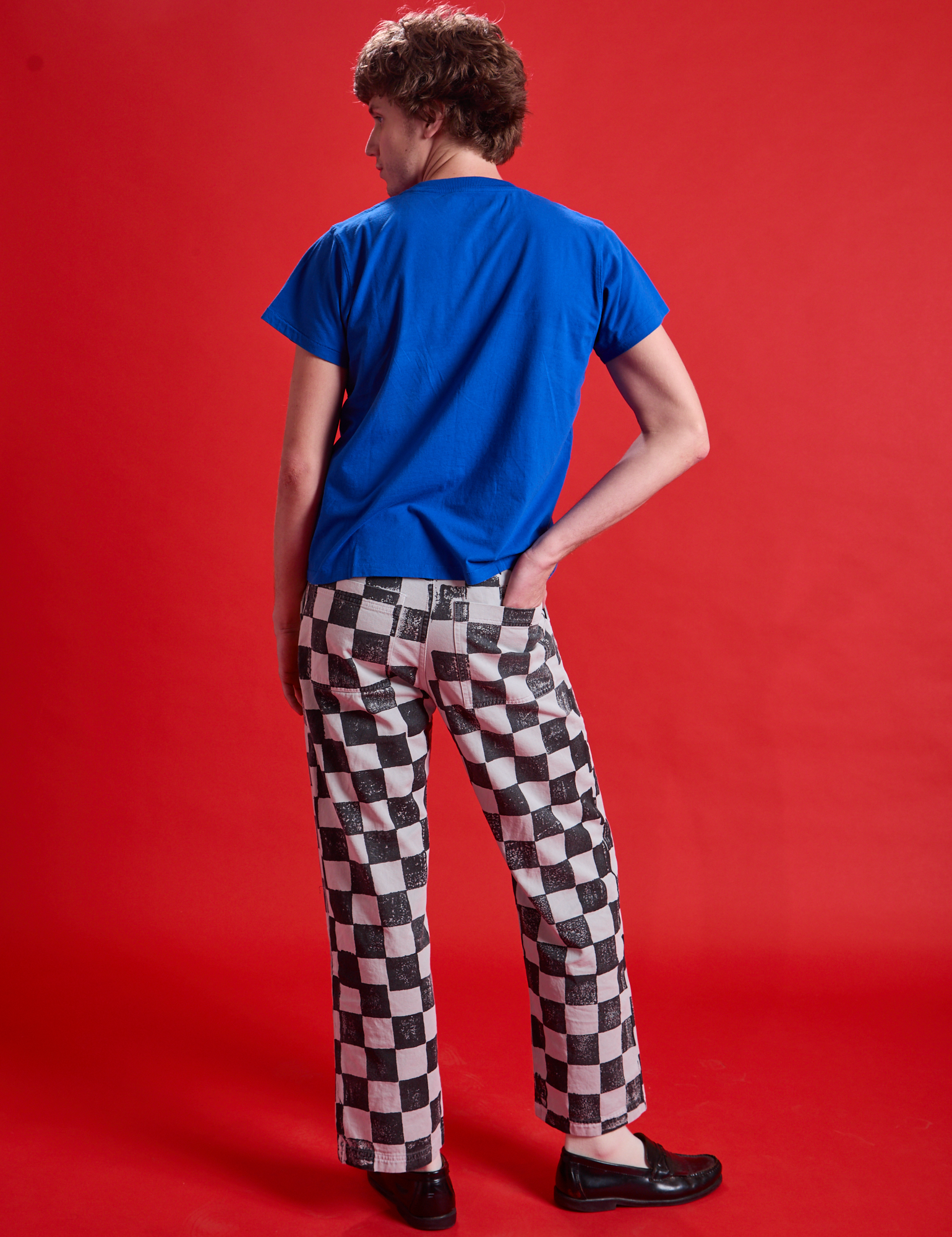 Back view of Checkerboard Work Pants in Black/White and royal blue Organic Vintage Tee
