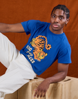 Isaac is wearing BBP Tiger Tee