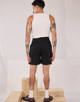 Back view of Trouser Shorts in Basic Black and Tank Top in Vintage Tee Off-White on Jesse