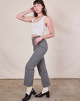 Side view of Work Pants in Washed Grey and Cropped Tank in Vintage Tee Off-White on Alex