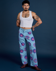 Jesse is 5’7” and wearing S Floral Painted Work Pants in Blue paired with a Cropped Tank in Vintage Tee White