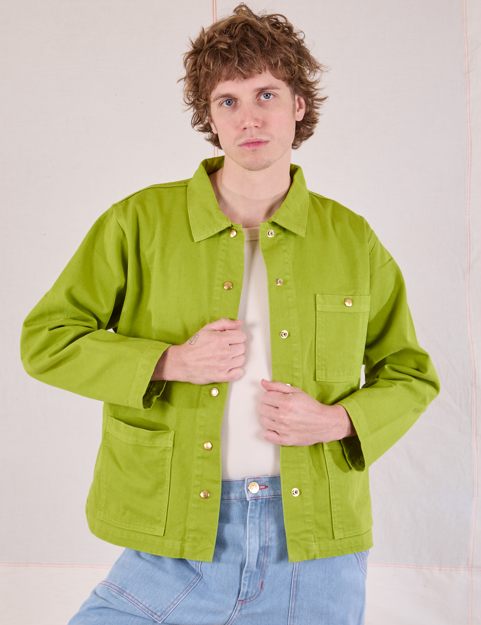 Quinn is 6'4" and wearing L Denim Work Jacket in Gross Green