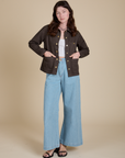 Alex is wearing Denim Work Jacket in Espresso Brown and light wash Indigo Wide Leg Trousers