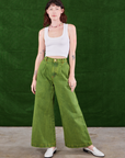 Alex is 5'8" and wearing XXS Overdyed Wide Leg Trousers in Gross Green and Cropped Tank Top in vintage tee off-white 