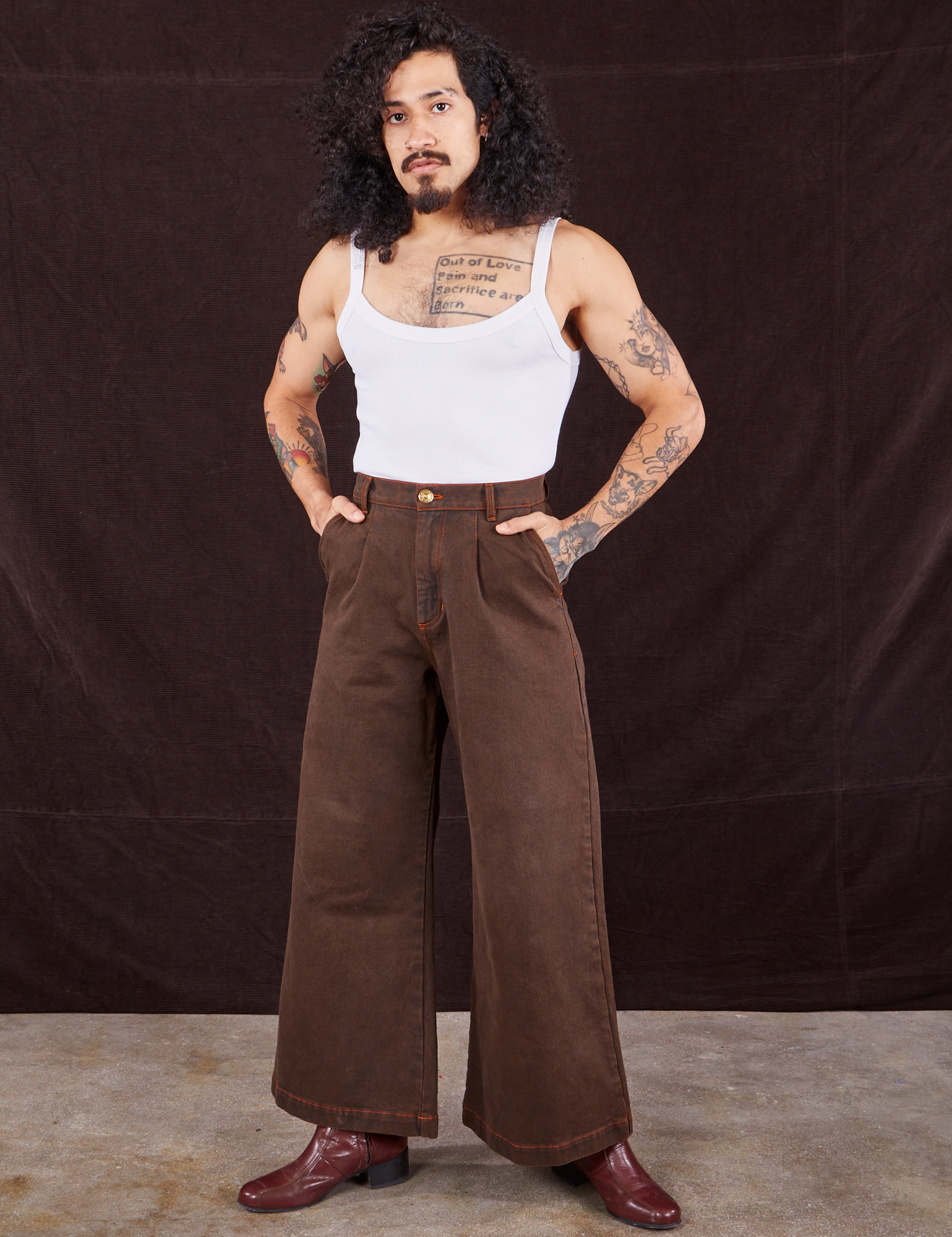 Jesse is 5&#39;8&quot; and wearing XXS Overdyed Wide Leg Trousers in Brown paired with vintage off-white Cami