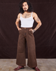 Jesse is 5'8" and wearing XXS Overdyed Wide Leg Trousers in Brown paired with Cropped Cami in vintage tee off-white