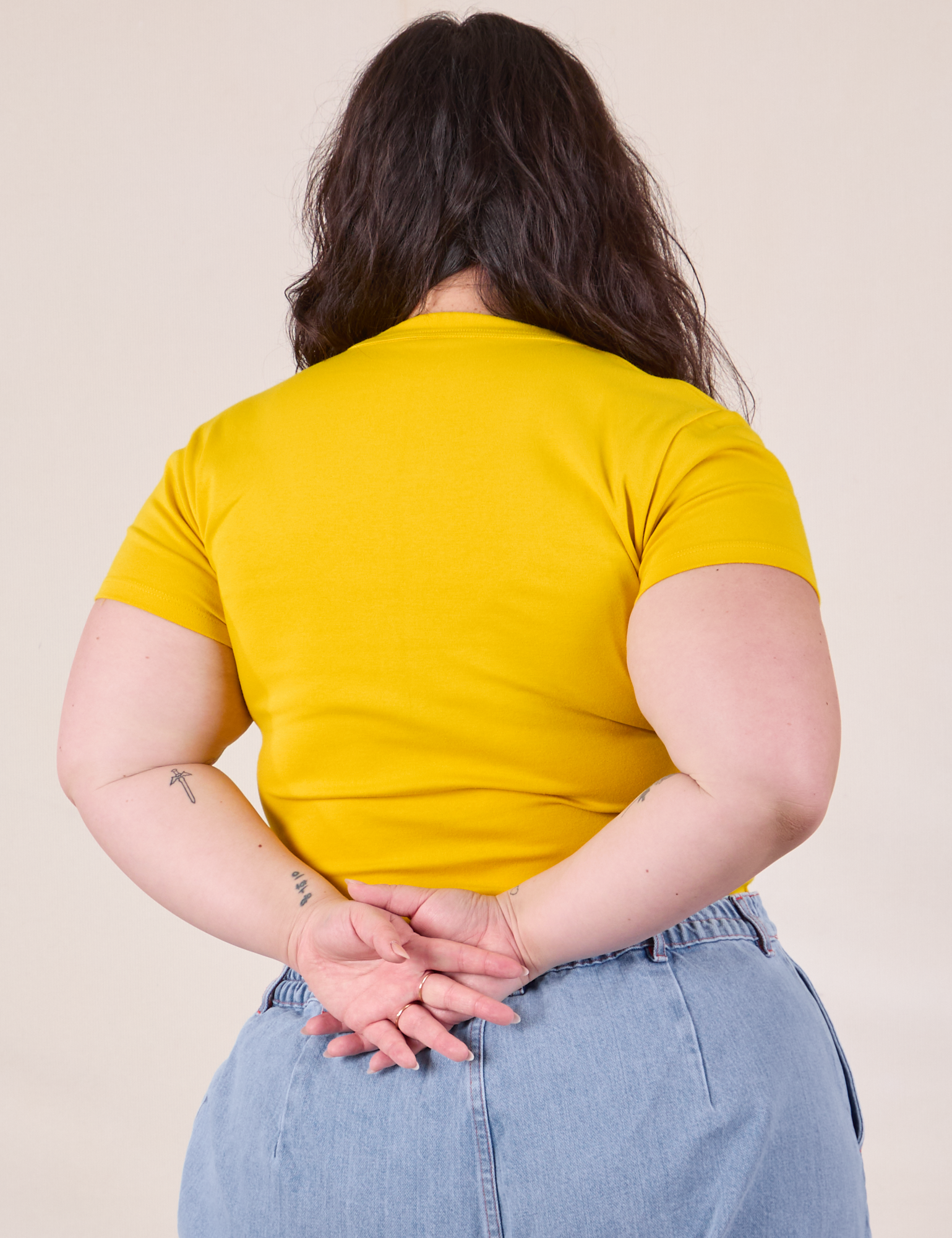 Baby Tee in Golden Yellow back view on Ashley
