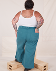 Back view of Bell Bottoms in Marine Blue and Cropped Cami in vintage tee off-white on Sam