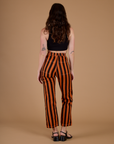 Back view of Black Stripe Work Pants in Construction Orange on Alex