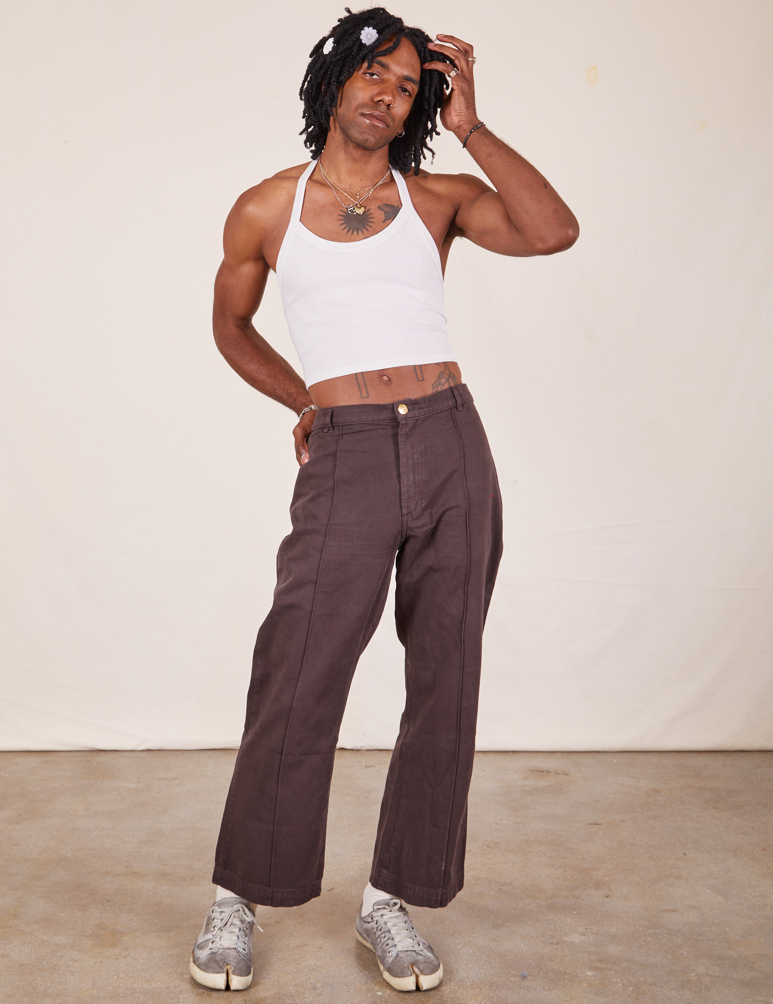 Jerrod is wearing Halter Top in Vintage Tee Off-White and espresso brown Western Pants