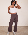 Jerrod is wearing Halter Top in Vintage Tee Off-White and espresso brown Western Pants