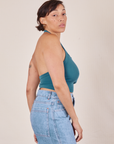 Side view of Halter Top in Marine Blue and light wash Sailor Jeans worn by Tiara