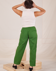 Back view of Heavyweight Trousers in Lawn Green and Sleeveless Turtleneck in vintage tee off-white worn by Tiara