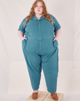 Catie is 5'11" and wearing 5XL Heritage Short Sleeve Jumpsuit in Marine Blue