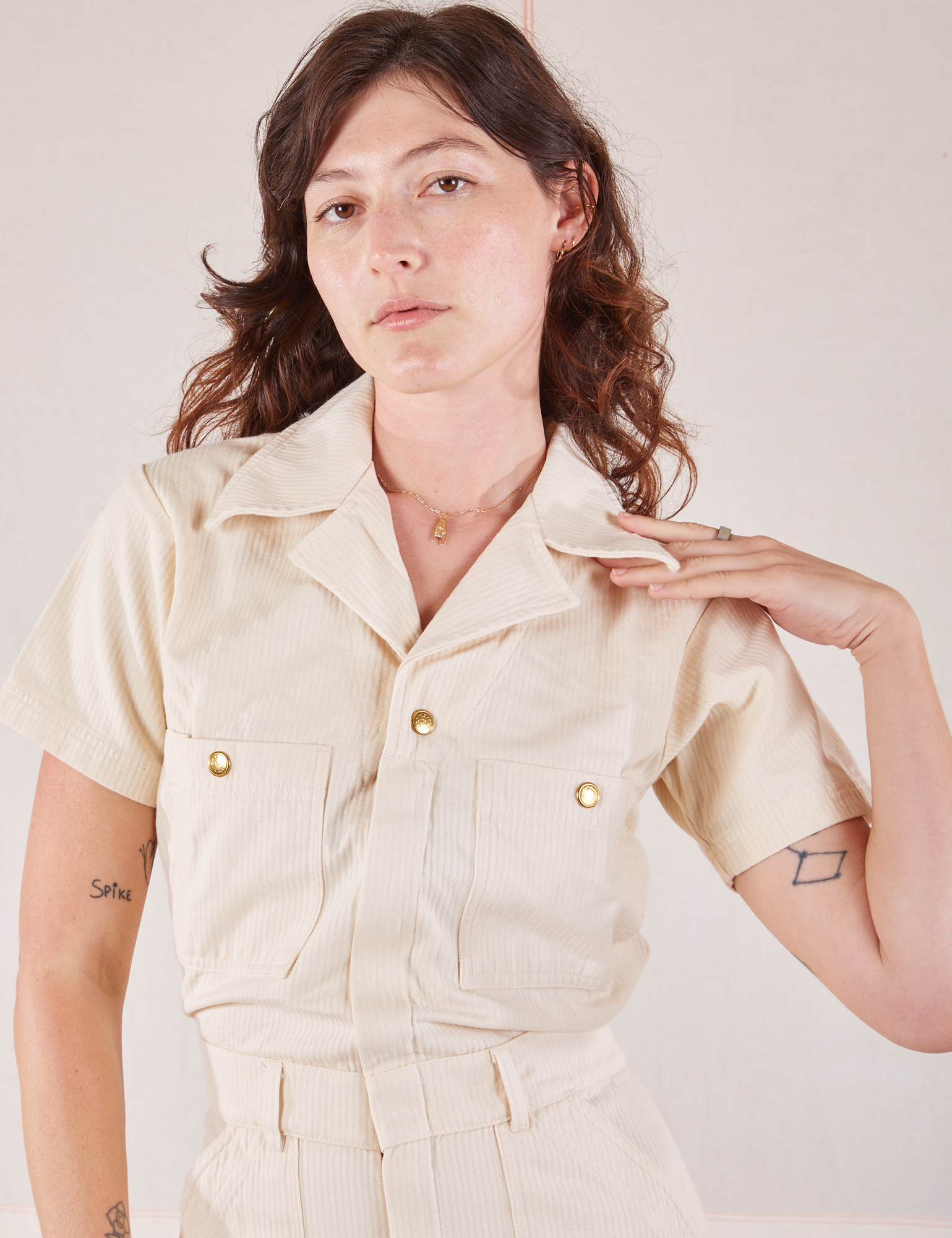 Heritage Short Sleeve Jumpsuit in Natural close up on Alex