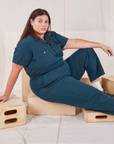 Katie is wearing Heritage Short Sleeve Jumpsuit in Lagoon