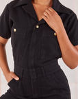 Heritage Short Sleeve Jumpsuit in Basic Black front close up on Mika