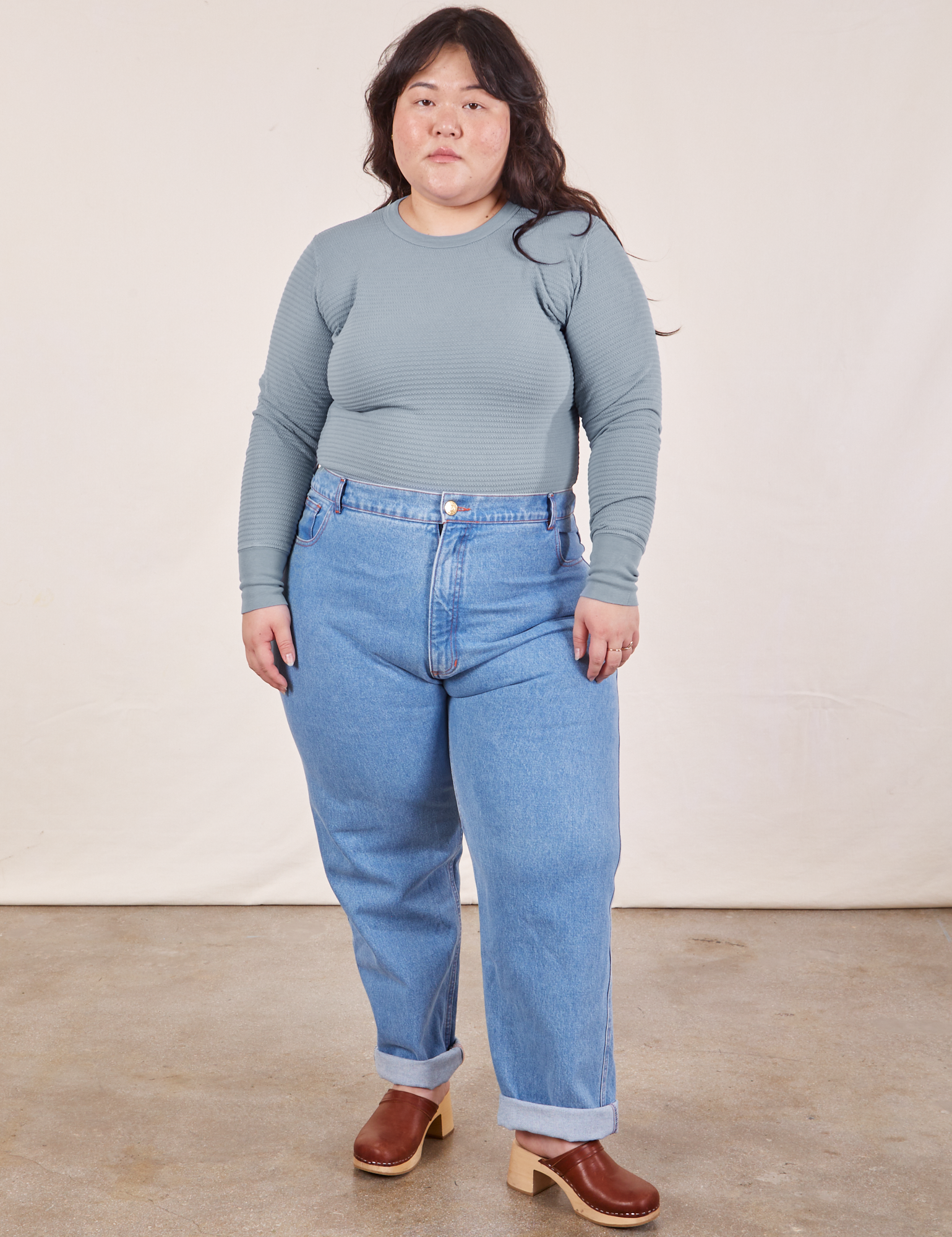 Ashley is wearing Honeycomb Thermal in Periwinkle tucked into light wash Frontier Jeans