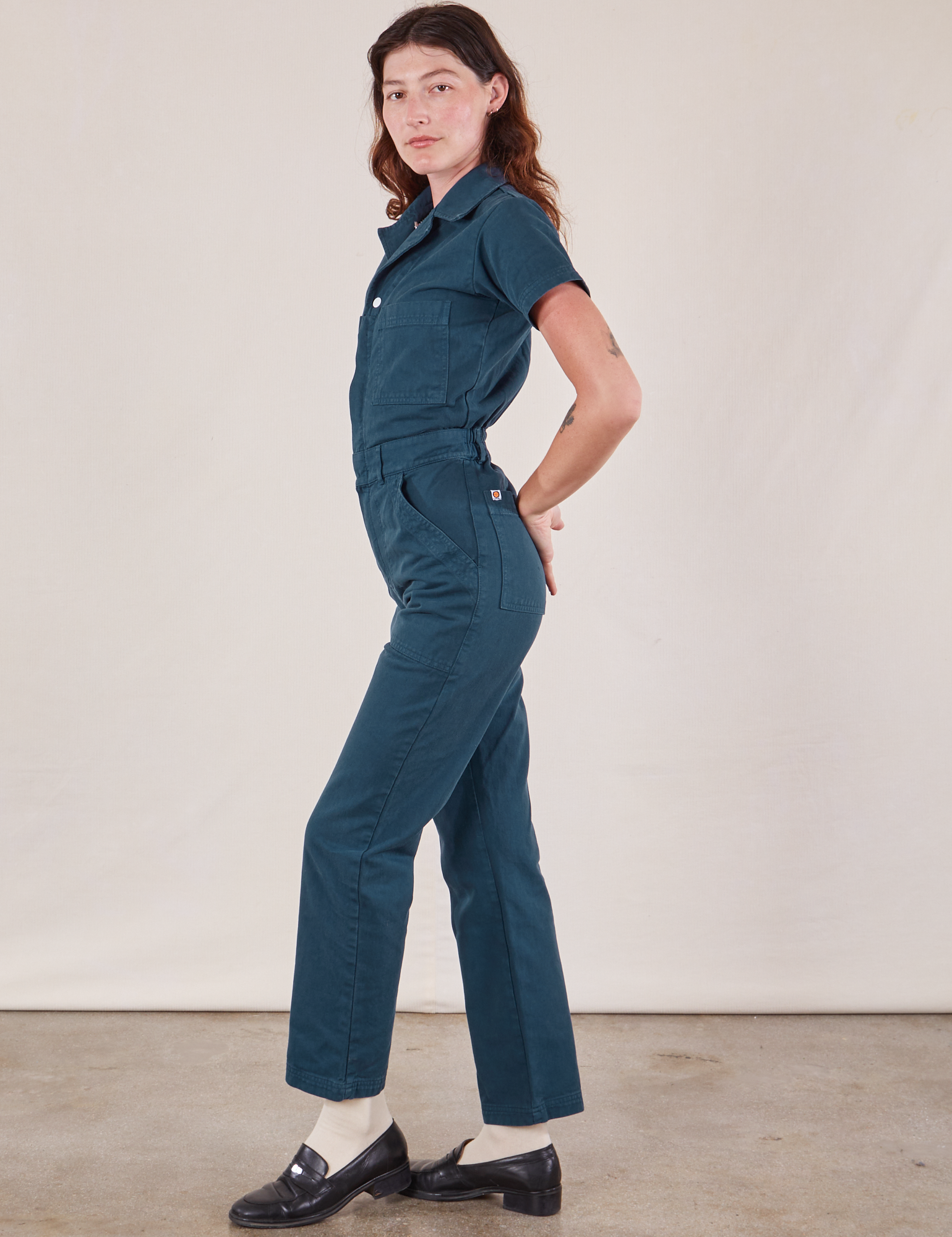 Short Sleeve Jumpsuit in Lagoon side view on Alex