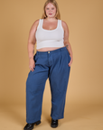 Juliet is 5'7" and wearing 1XL Baggy Mid-Rise Trousers in French Blue paired with vintage tee white Cropped Tank