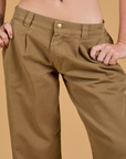 Baggy Mid-Rise Trousers in Desert Brown front close up on Alex