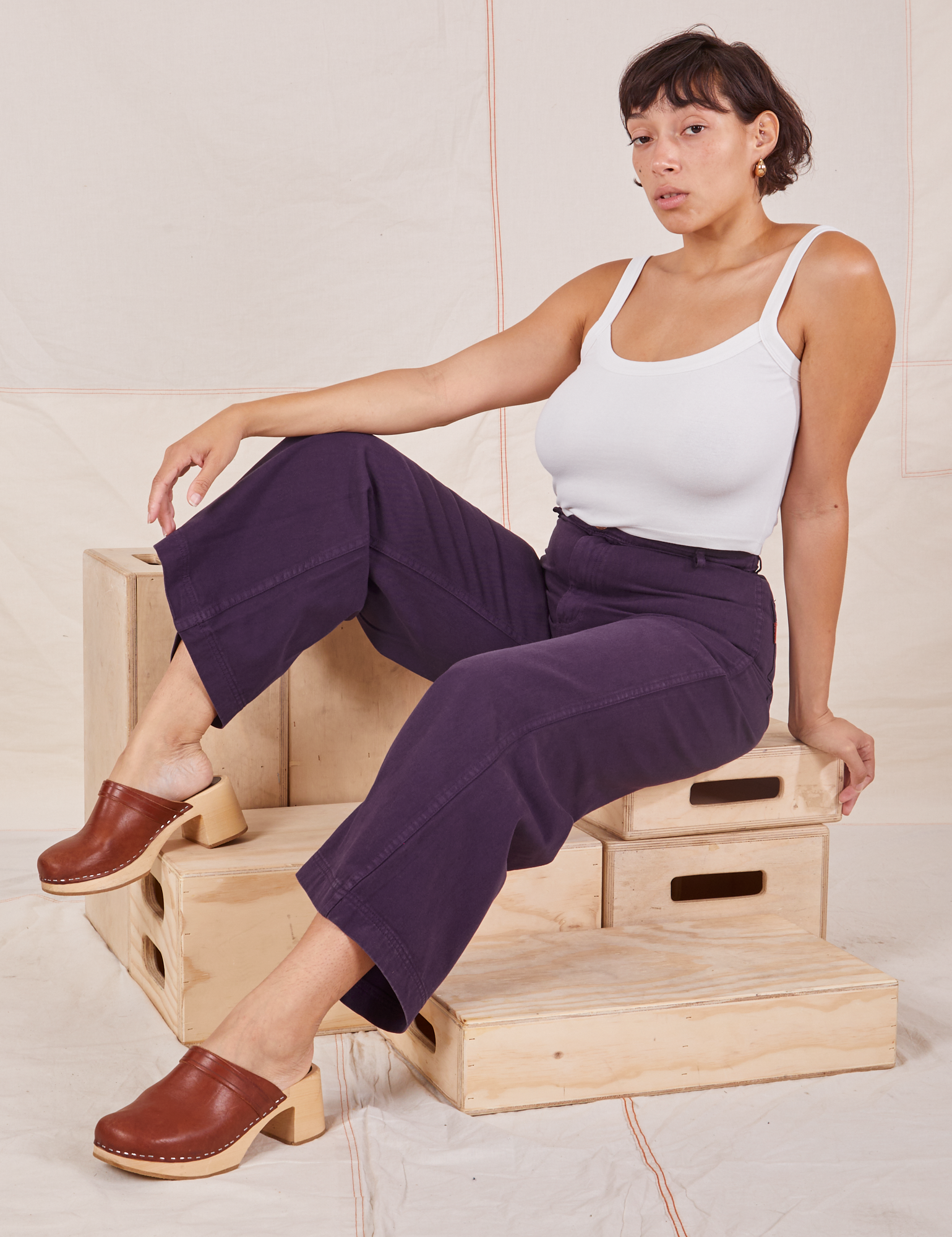 Tiara is wearing Bell Bottoms in Nebula Purple and Cropped Cami in vintage tee off-white