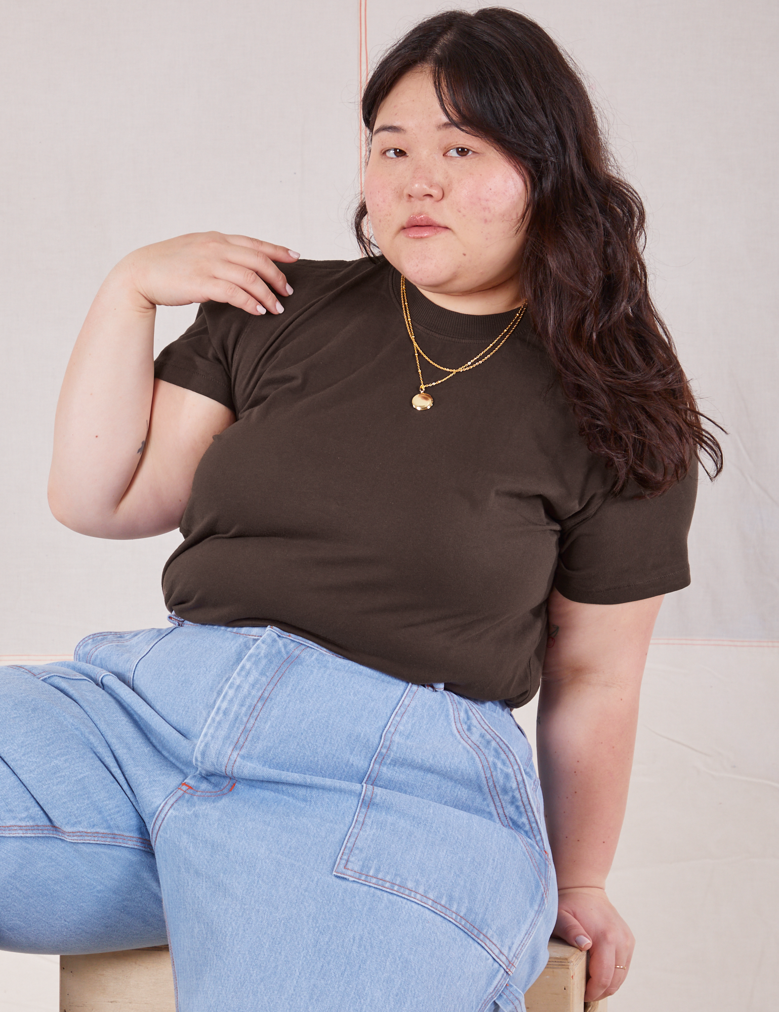 Ashley is wearing Organic Vintage Tee in Espresso Brown and light wash Carpenter Jeans
