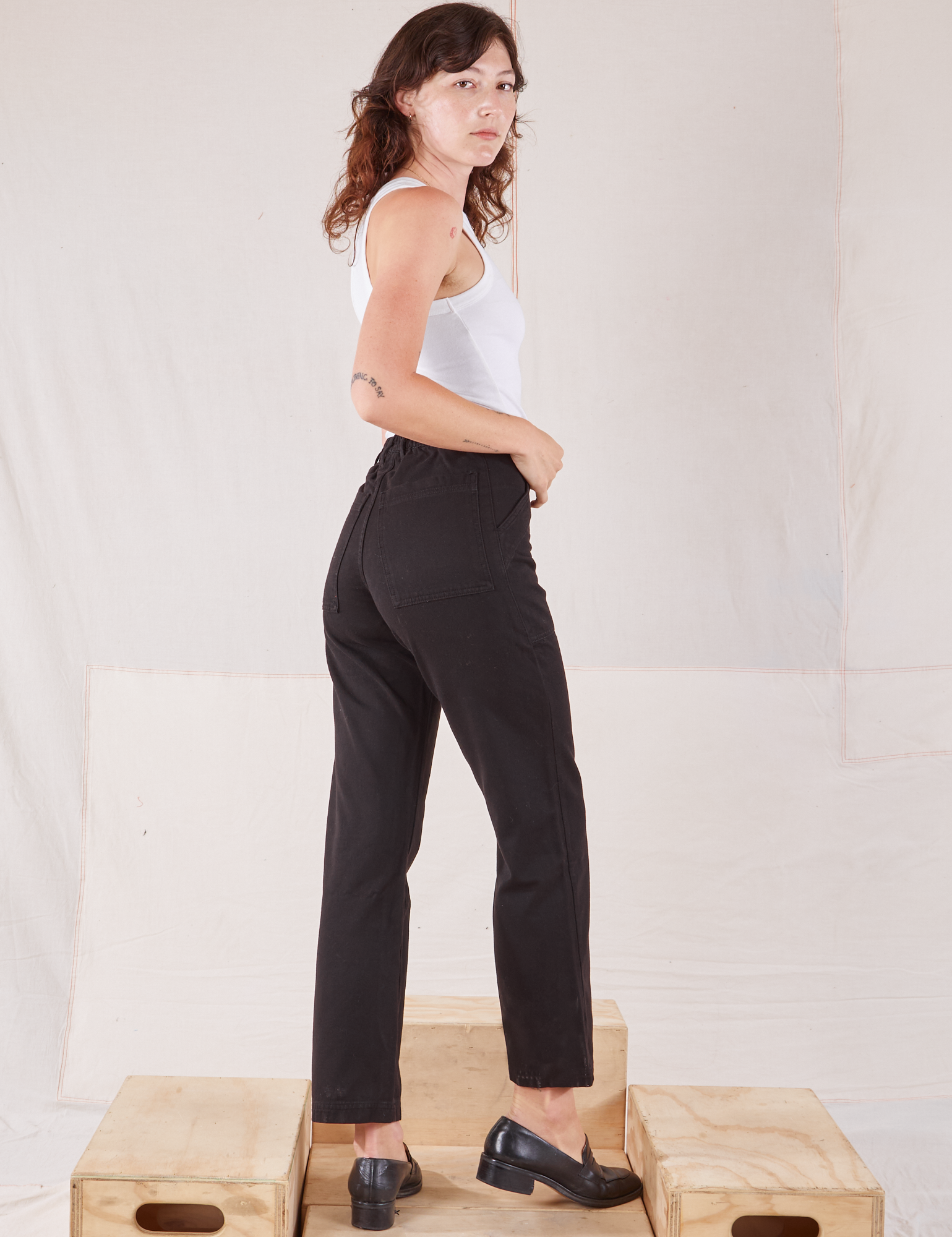 Organic Work Pants in Basic Black angled back view on Alex