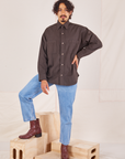 Jesse is wearing a buttoned up Oversize Overshirt in Espresso Brown