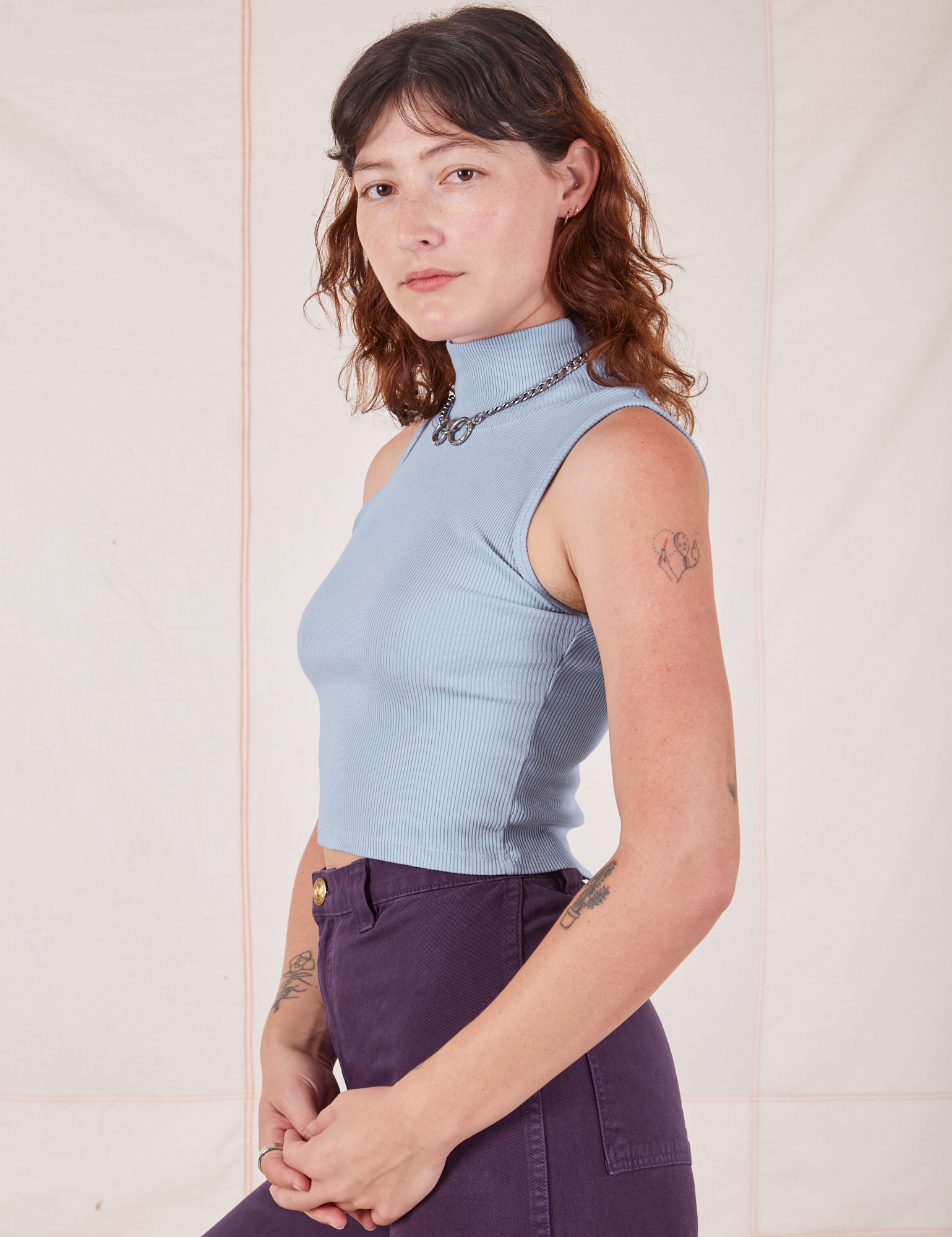 Side view of Sleeveless Essential Turtleneck in Periwinkle on Alex