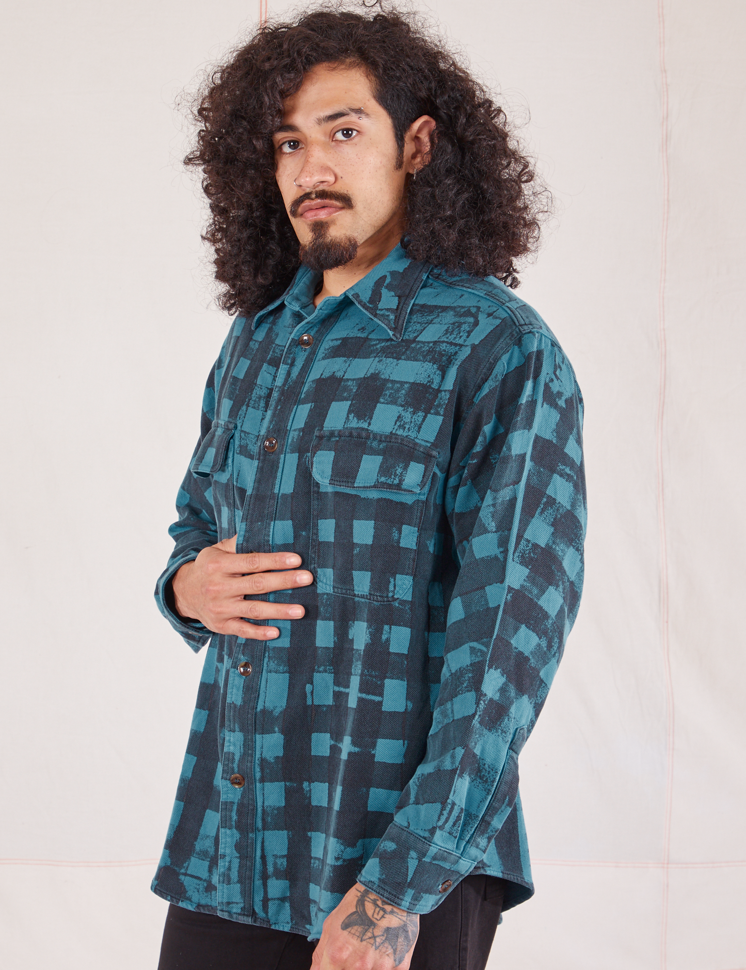 Angled view of Plaid Flannel Overshirt in Marine Blue on Jesse