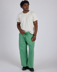 Isaac is 5’10” and wearing M Drop Pocket Cargo Pants in Seafoam Green paired with Organic Vintage Tee in Vintage Tee White