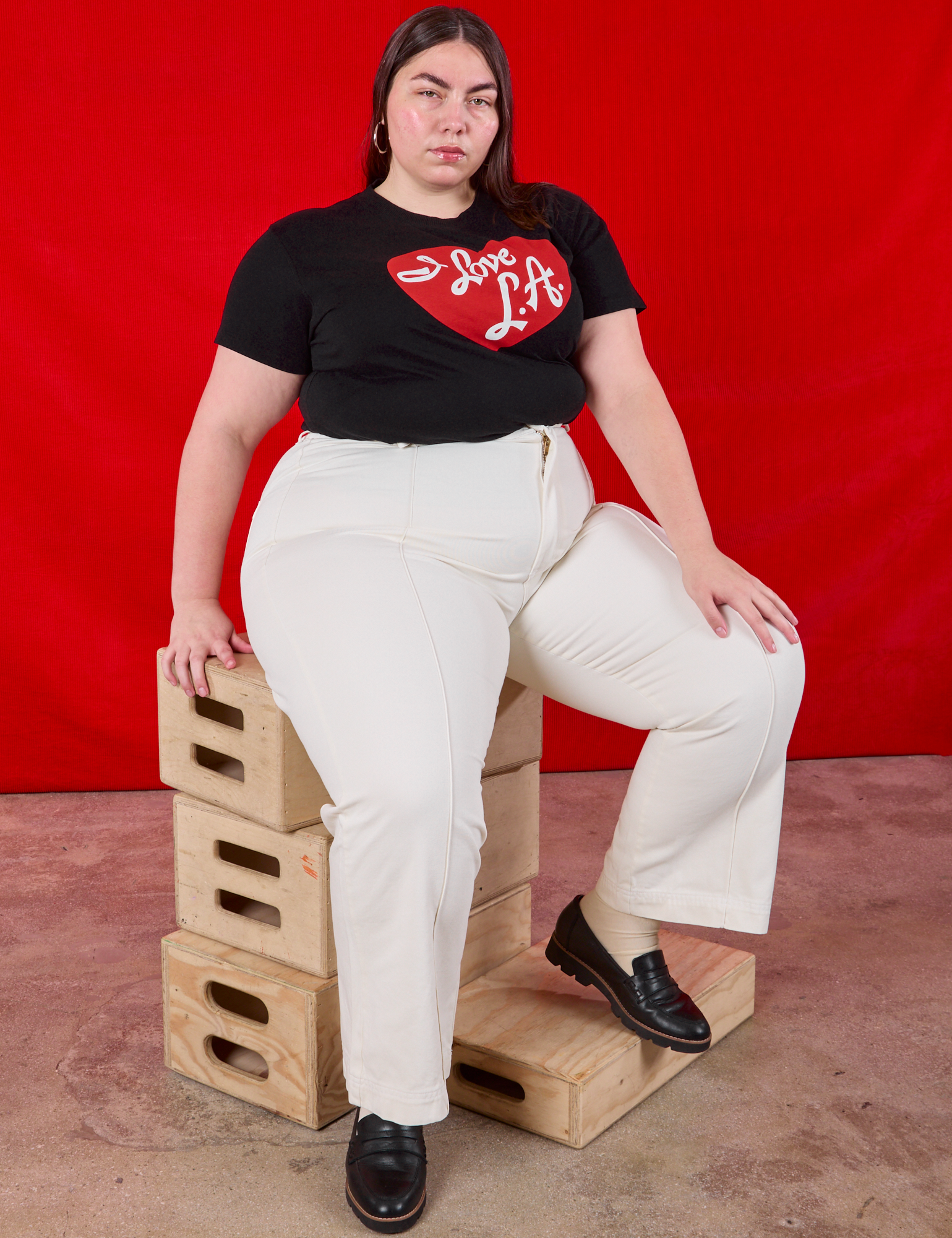 Marielena is wearing I love LA Tourist Tee and vintage tee off-white Western Pants