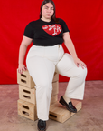 Marielena is wearing I love LA Tourist Tee and vintage tee off-white Western Pants
